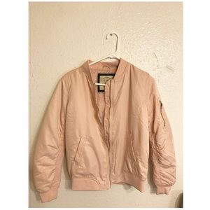 A light pink bomber jacket